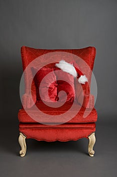 Bright red chair with santa hat