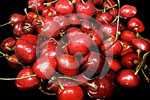 Bright red cherry berries in water