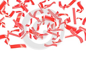 Bright red confetti falling on white background