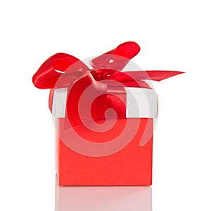 Bright red gift box with bow isolated on white