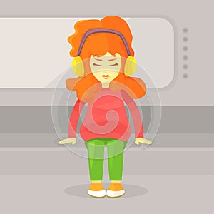 A bright red-haired girl is sitting in the subway