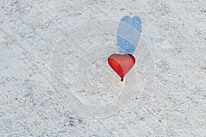 Bright red hot air balloon in the shape of heart