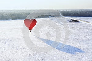 Bright red hot air balloon in the shape of heart