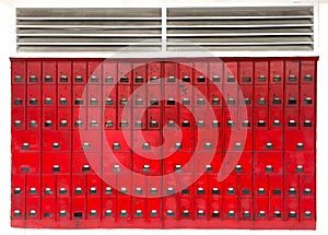 Bright red letter boxes on the wall