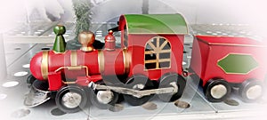 Bright red New Year\'s locomotive with wagons. Gift for Christmas.