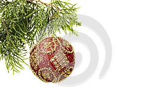 Bright red ornated Christmas bauble on white background