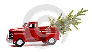 Bright Red Pickup Truck Hauling a Tree for Christmas