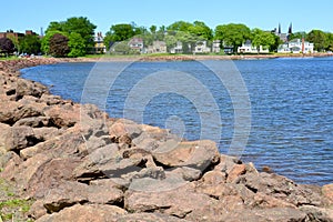 Bright red rocks forming barrier along Charlottetown Harbour