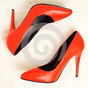 Bright red sexy shoes with stilettos. Shoes for Christmas. View from above.