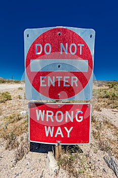 Bright Red sign warns drivers not to enter this lane of highway, Interstate 15, in desert outside of Las Vegas - WARNING - WRONG W