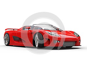 Bright red sports car on white background