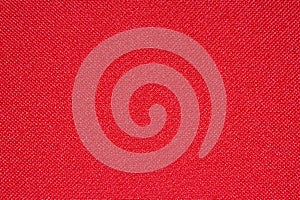 Bright red texture of dense fabric.