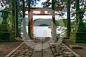 Bright red Torii gate on the lake Ashi