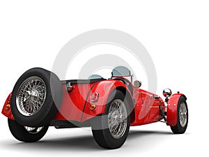Bright red vintage open wheel sport racing car - back view
