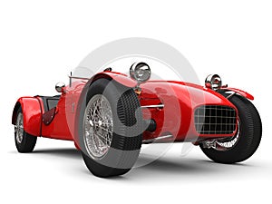Bright red vintage open wheel sport racing car - low angle closeup shot