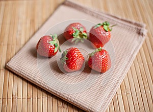 Bright, ripe, delicious strawberries in a white plate