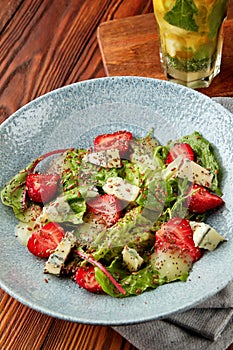 Bright salad with strawberry, spinach and blue cheese