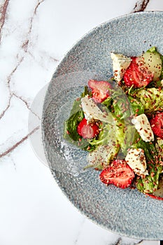 Bright salad with strawberry, spinach and blue cheese