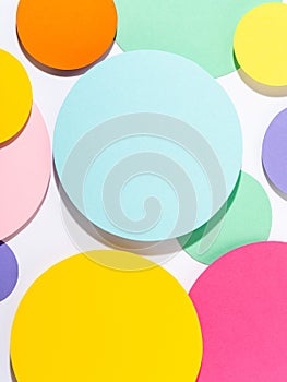 Bright saturated background with cut out paper circles.