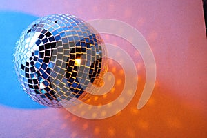 Bright shiny disco ball on color background. Space for text