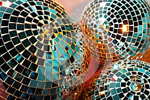 Bright shiny disco balls on color background, closeup