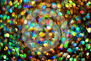 Bright shiny glowing bokeh art background. Festive abstract colorful background with bokeh defocused lights. Lights