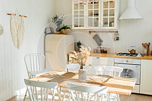 Bright spacious dining room with wooden big table