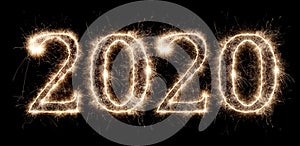 Bright sparkler pyrotechnic fireworks number 2020 happy new year sylvester concept isolated black background