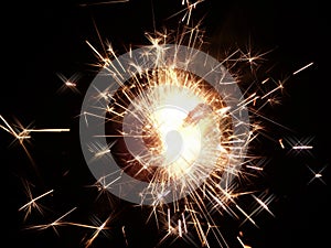 Bright sparklers on black background