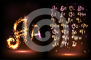 Bright sparkling alphabet on a brown background
