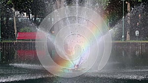 Bright sparkling fountain with vibrant rainbow