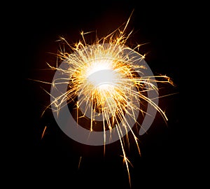 Bright sparks on deep black background closeup