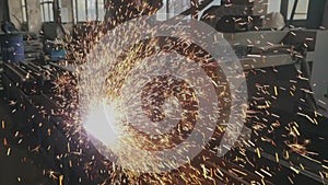Bright sparks from metal slowmotion, metal cutting. Sparks from metal cutting slowmotion