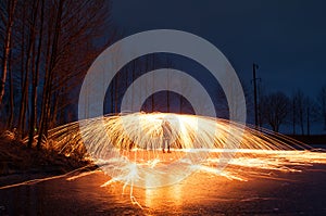 Bright sparks from the steel wool,