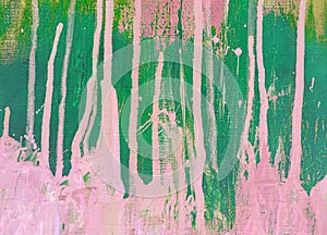 Bright spots and stains of pink and green paint on the canvas. Abstract background.