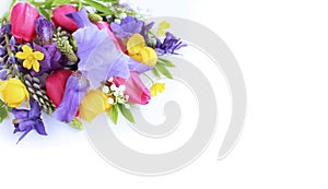 Bright spring flower arrangement. Lilac Alstroemeria and Aquilegia, as well as yellow flowers of trolius europaeus and crimson tul