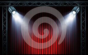 Bright stage spotlights shining on red curtain background