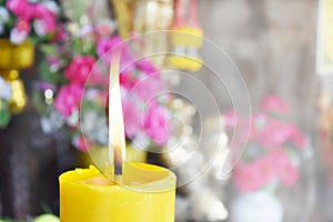 Bright style background. Burning candles and flowers for worship