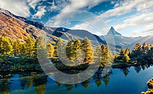 Bright summer view of the Grindjisee lake. Sunny morning scene with Matterhorn Monte Cervino, Mont Cervin peak, Swiss Alps,