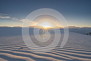 Bright Sun Setting Over White Sands