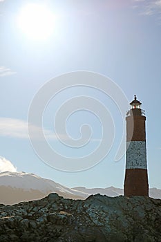 Bright Sun Shining over Les Eclaireurs lighthouse on a rocky islands in Beagle channel, Ushuaia, Patagonia, Argentina