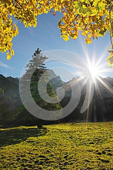 Bright sunburst, autumnal landscape karwendel, austria