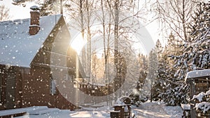 Bright sunny landscape with snow falling snow and a small house in the forest, cinemagraph, video loop
