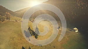 Bright sunny mountain meadow landscape aerial view