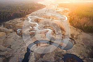 Bright sunrise over wild curved river aerial view