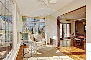 Bright sunroom with antique chair