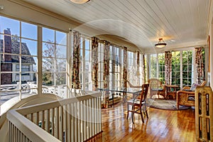 Bright sunroom with wicker furniture