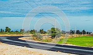 Bright sunshine day time Highway curve road overpass nature landscape background street tall lanterns trees bushes