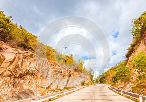 Bright sunshine day time Highway curve road overpass nature landscape background street tall lanterns trees bushes