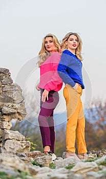 Bright sweaters and pants increase activity add cheerfulness and improve mood. Girls wear bright clothes. Vivid style photo